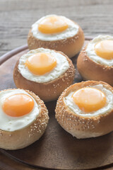 Egg-in-a-hole buns on the wooden board