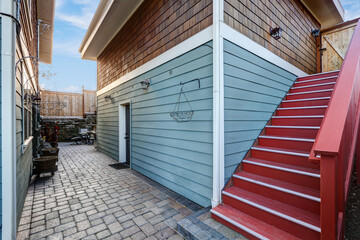 Detached two story garage with blue siding