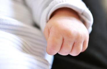 Tiny infant hand, macro with low depth of field.