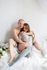 Obraz na płótnie Canvas Happy pregnant couple expecting a baby.