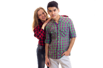 Young couple in plaid shirts