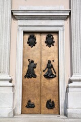 Wooden door of Church San Nicolo in Lecco, Lake Como Italy