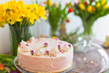 Fototapeta na wymiar Beautiful cake and spring flowers