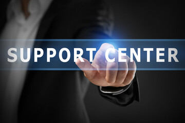 Male hand with finger pointing on dark background