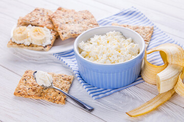 Healthy breakfast including cottage cheese and grainy biscuits