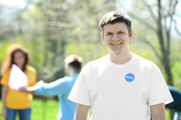 Naklejka premium Handsome young volunteer outdoors