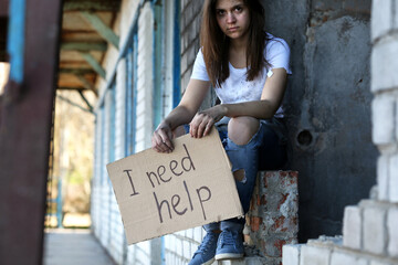 Poor woman begging for help on the street