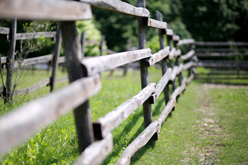 Closeup of wooden fence on a corral farmland rural scene