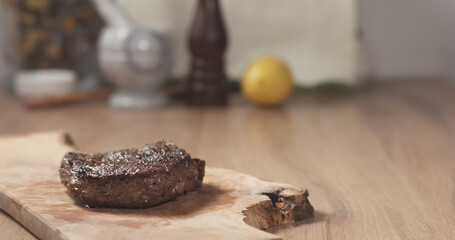 medium rib eye steak on board, wide photo