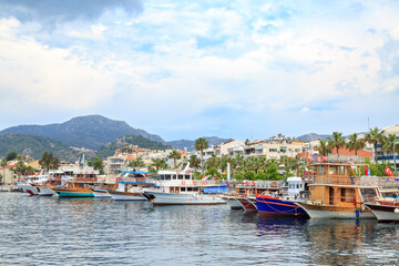 Fototapeta na wymiar Marmaris center with seaport along boats in Marmaris, Turkey