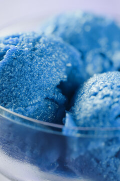 blue sorbet ice cream in glass bowl, shallow focus