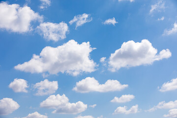 Blue sky with fluffy cumulus clouds