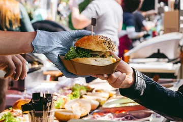 Delicious fresh burger on food market, ready to eat. Close-up © fedorovacz