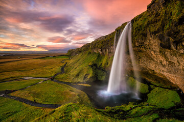 Seljalandsfoss waterfall at sunset