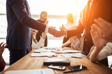 business and office concept - businessman shaking hands each oth