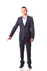 Young businessman pointing down