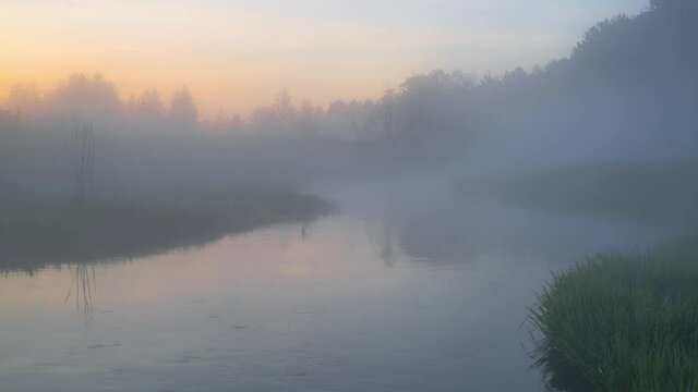 fog over the river at sunset