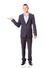 Smiling businessman holding copyspace