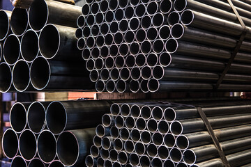 Aluminum and chrome stainless pipes in stack waiting for shipment