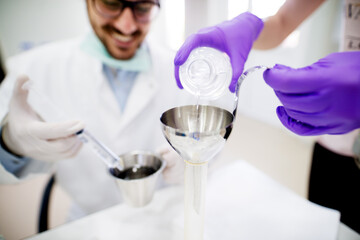 Lab technicians doing chemical analysis. Testing chemical composition of the water.