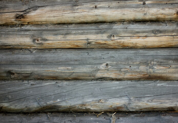gray brown old log wall, background with wood texture