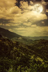 Fototapeta premium Beautiful landscape of dark night sky and cloudy above mountain peak.