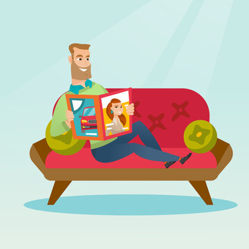 Man reading a magazine on the couch.