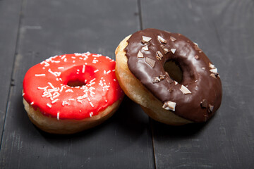Colorful donuts on stone table. Top view
