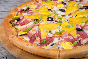 Pizza served on a wooden board