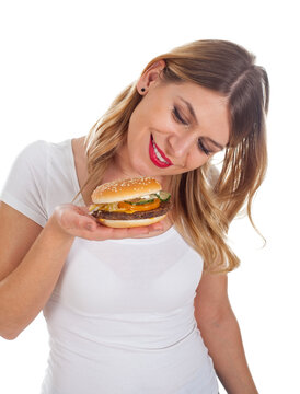 Pretty woman eating a delicious hamburger
