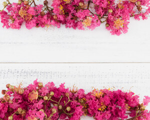 Crape myrtle flowers bouquet on white wood background with copy space