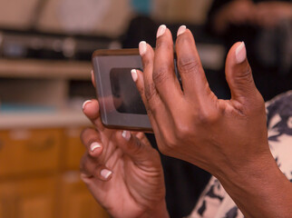 Black women holdinga cell phone