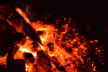 Fototapeta na wymiar Fire and embers of a campfire