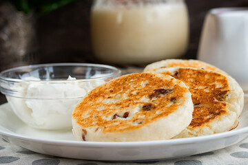 Cheesecakes for breakfast on a dark wooden background