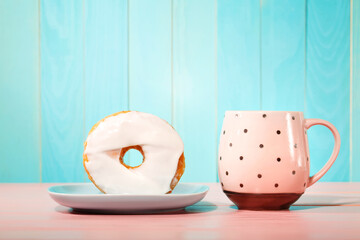 Donut and dish with pink mug