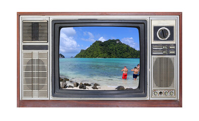 Retro television on white background with image of beach on screen.