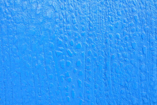 Blue Piant on Wood Board Background.