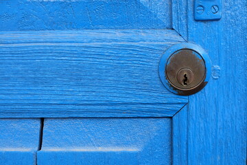 Close up Keyhole with Wood Blue Door.