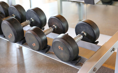 Closeup of dumbbells in gym.