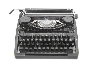 Antique typewriter against a crisp white backdrop.