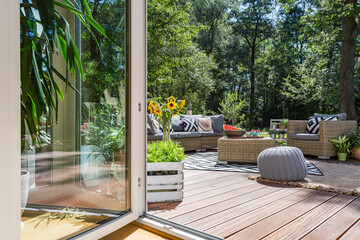 Wooden terrace with garden furniture