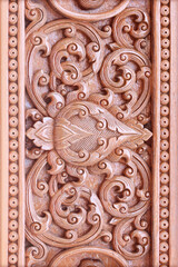 Pattern of flower carved on wood background