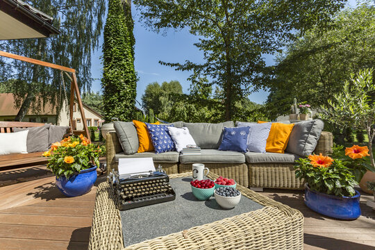 Terrace with garden furniture and typewriter
