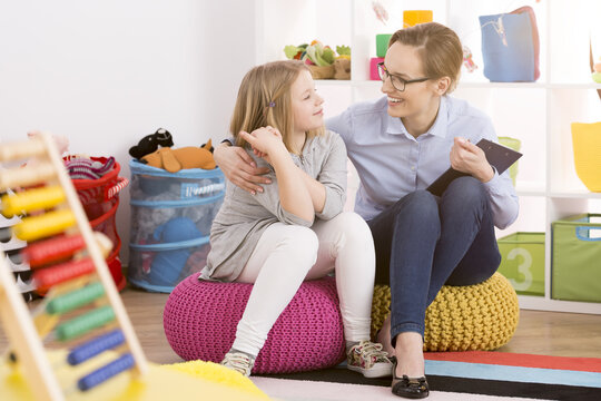 Speech therapist working with child