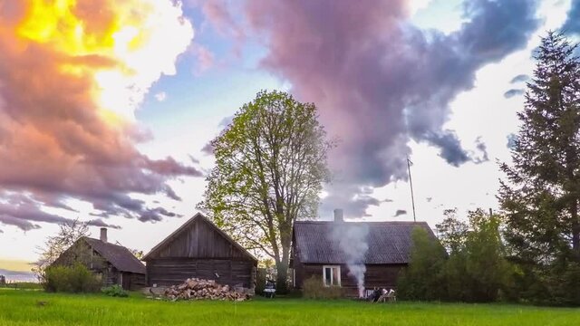 Small village in Estonia. Ttimelapse footage. Massive colorful clouds.