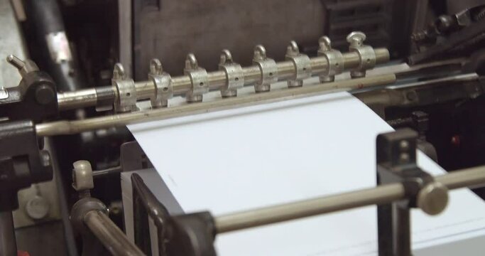 closeup of print machine tooks paper