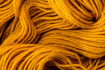 Close up the golden yellow yarn thread as abstract  background