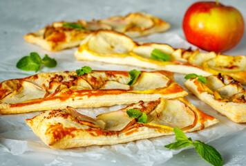 Ruddy puffs with apple, mint and cinnamon. Baking with an apple.