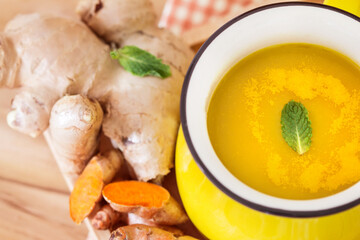 a cup of Turmeric Tea with lemon and ginger , Benefits for reduce Inflammation , Liver Detox and Cleanser healthy herb drink concept