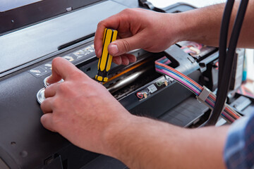 Repairman repairing broken color printer